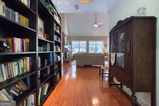 corridor featuring lofted ceiling and hardwood / wood-style flooring