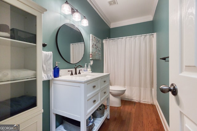 bathroom featuring a shower with shower curtain, crown molding, toilet, wood-type flooring, and vanity