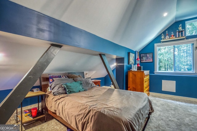 bedroom with carpet flooring and vaulted ceiling