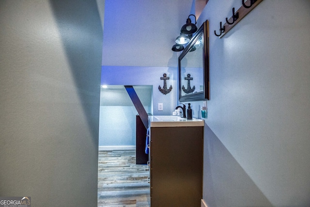 corridor featuring hardwood / wood-style floors and sink