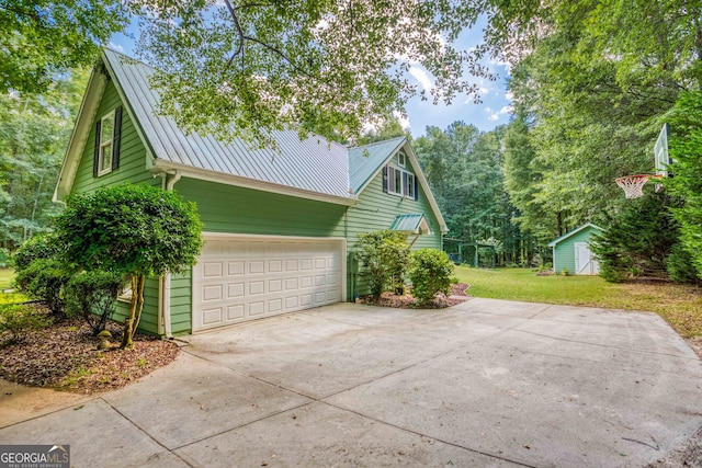 view of property exterior featuring a lawn and a garage