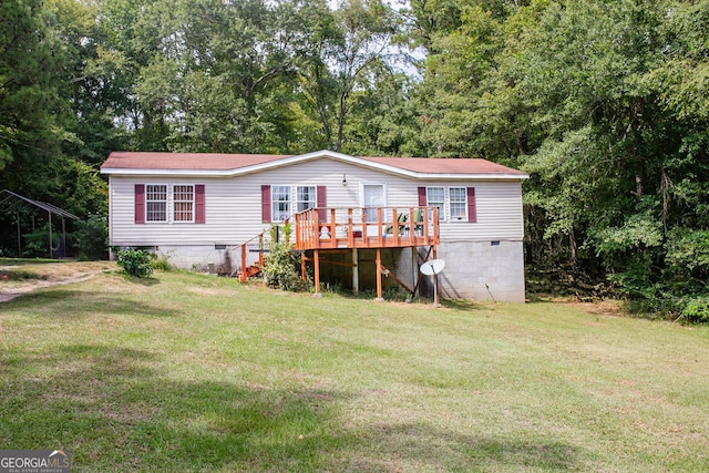 exterior space with a yard and a deck