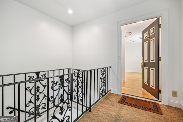 hall with recessed lighting, wood finished floors, and baseboards