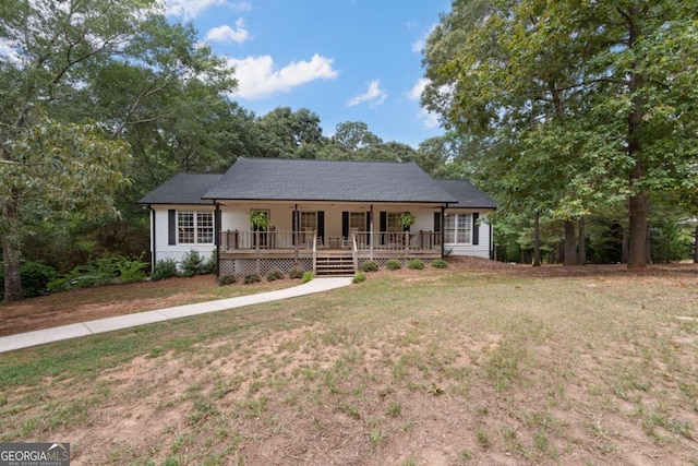 ranch-style house featuring a front yard and a porch