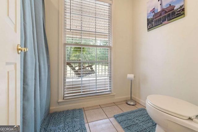 bathroom with tile patterned floors and toilet