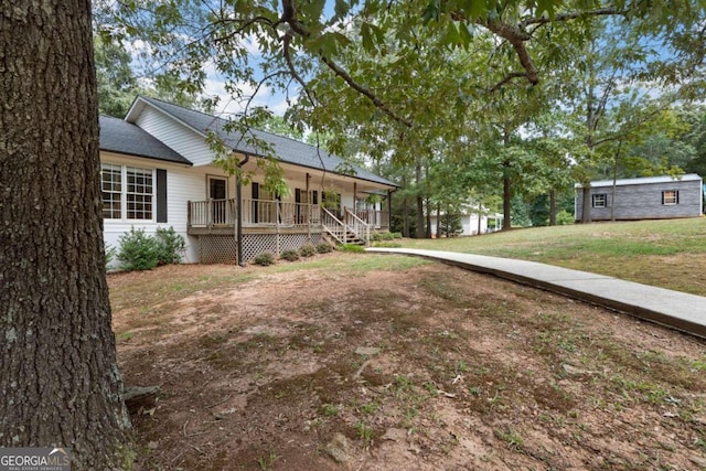 view of yard featuring covered porch