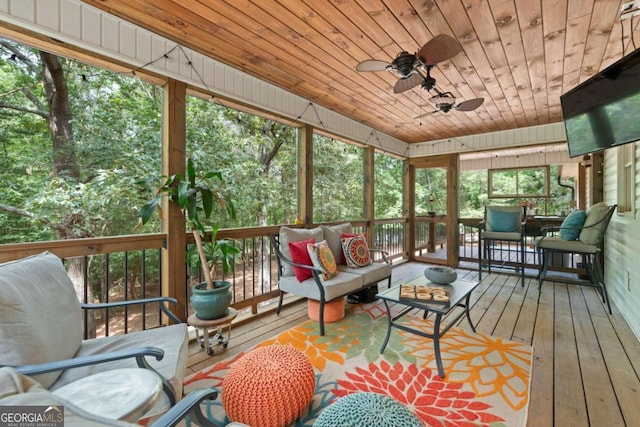 sunroom with wood ceiling and ceiling fan