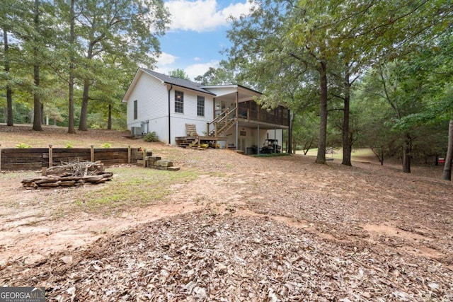 exterior space featuring a deck and a fire pit