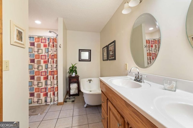 bathroom featuring vanity, a textured ceiling, shower with separate bathtub, and tile patterned flooring