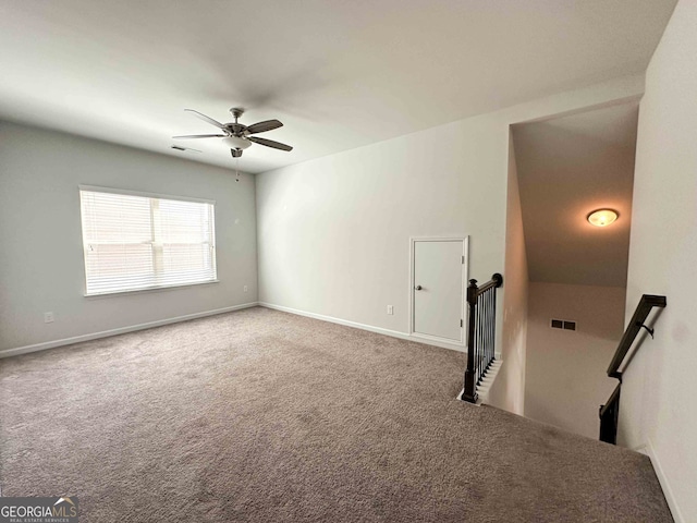 spare room with carpet flooring and ceiling fan