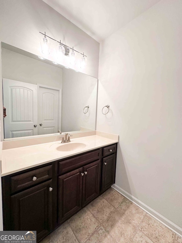 bathroom with tile patterned flooring and vanity