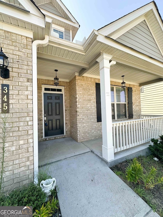 doorway to property with a porch