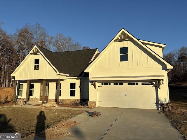 view of front of property featuring a porch and a garage