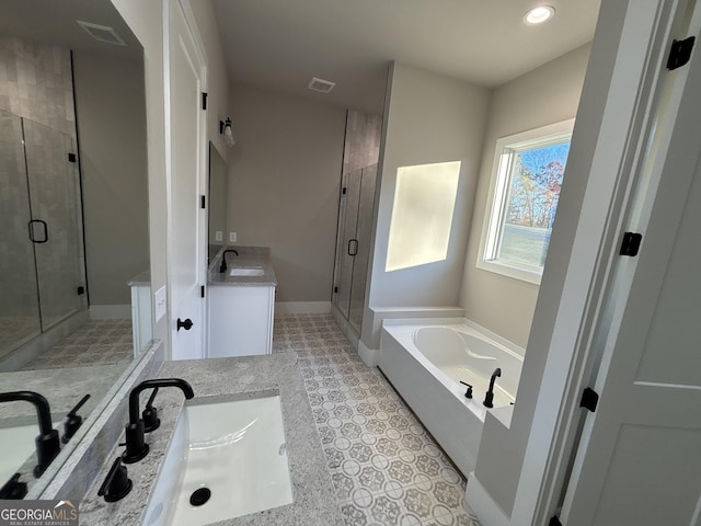 bathroom with tile patterned flooring, vanity, and separate shower and tub