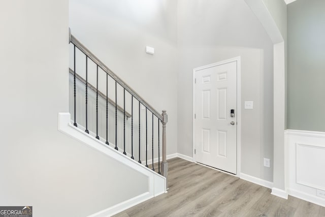 foyer entrance with light hardwood / wood-style floors