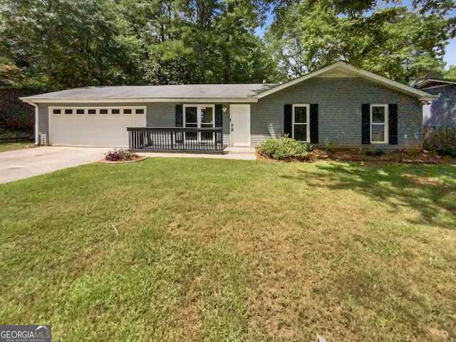 ranch-style house with a front yard, concrete driveway, brick siding, and an attached garage