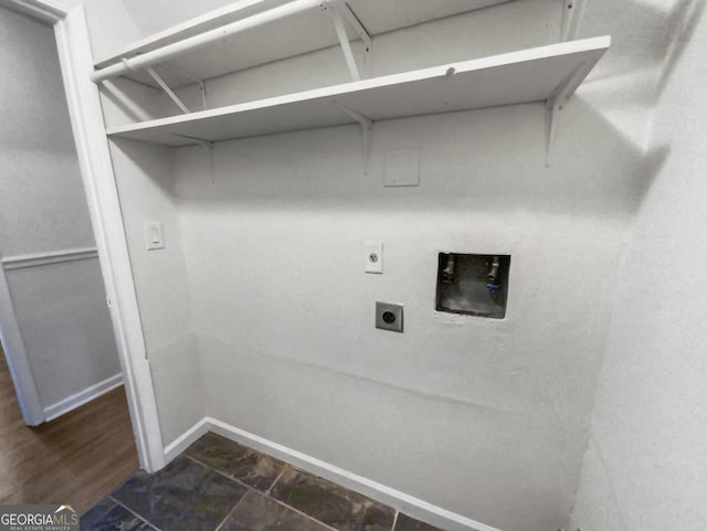 clothes washing area featuring laundry area, hookup for a washing machine, baseboards, and hookup for an electric dryer