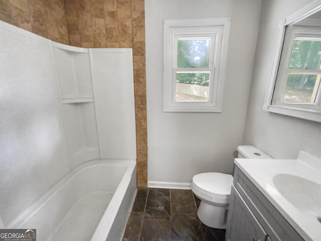 full bath with toilet, baseboards, a wealth of natural light, and vanity