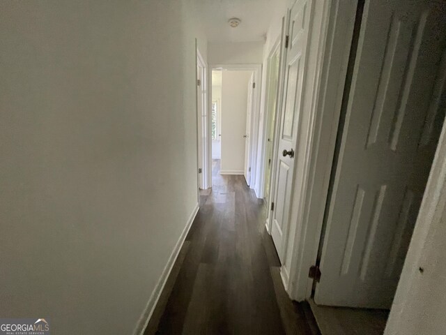 hallway featuring wood-type flooring