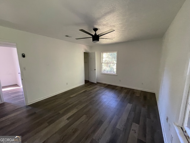 spare room with ceiling fan and hardwood / wood-style flooring