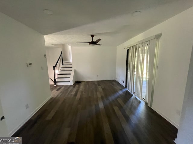 unfurnished living room featuring hardwood / wood-style flooring and ceiling fan