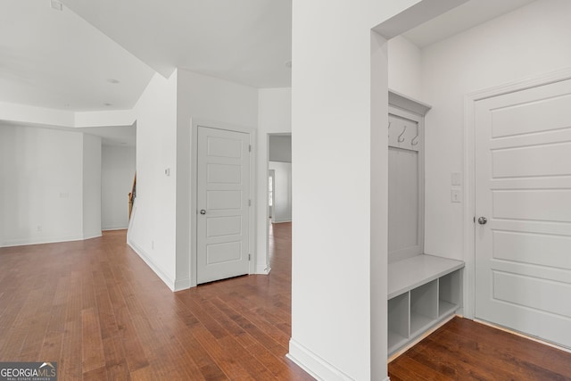 mudroom featuring wood finished floors and baseboards