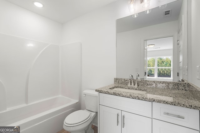 bathroom featuring toilet, shower / washtub combination, vanity, and visible vents