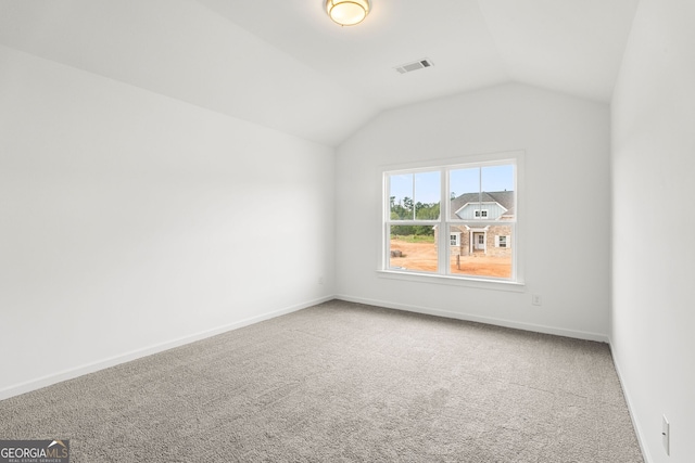 additional living space with lofted ceiling, carpet, visible vents, and baseboards