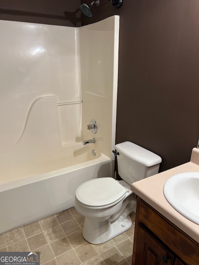 full bathroom featuring tile patterned flooring, vanity, toilet, and bathtub / shower combination