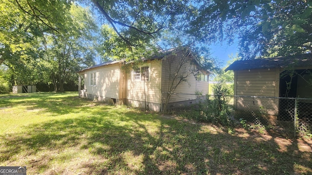 view of home's exterior with a yard