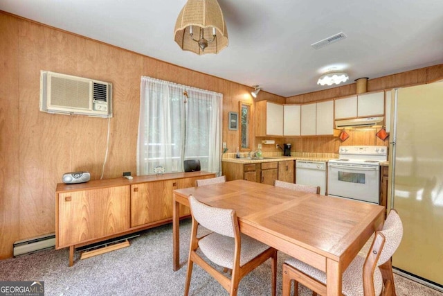 kitchen with light carpet, a baseboard radiator, sink, white appliances, and a wall mounted air conditioner