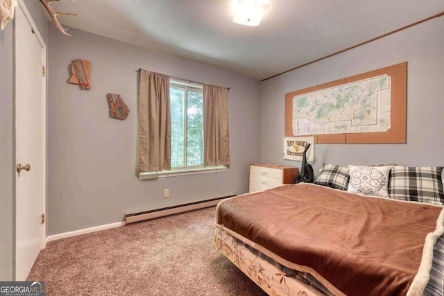 carpeted bedroom featuring baseboards and a baseboard heating unit