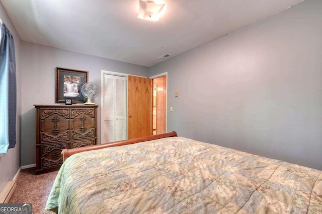 bedroom with carpet flooring and a closet