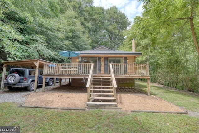 view of front of home featuring a carport and a deck