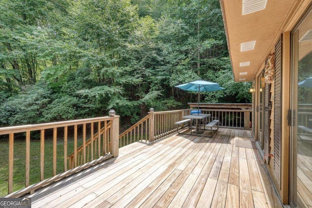 deck featuring a lawn