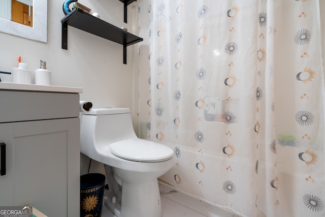 full bathroom featuring toilet, shower / tub combo with curtain, tile patterned floors, and vanity