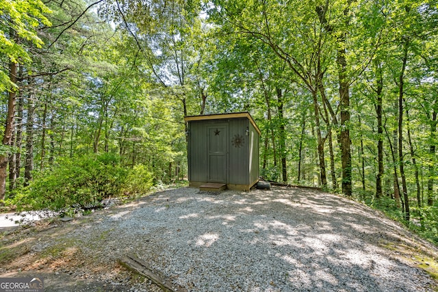 exterior space featuring a shed