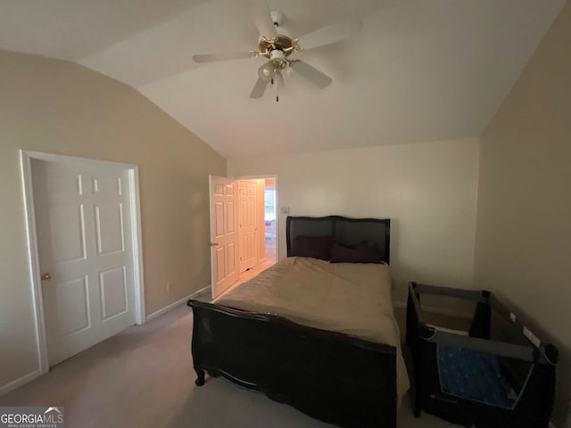 bedroom with carpet, vaulted ceiling, and ceiling fan