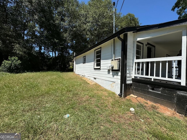 view of property exterior with a lawn