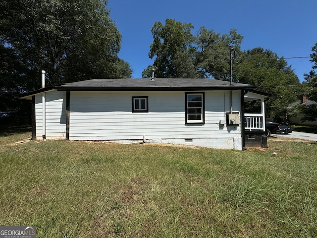 view of home's exterior with a lawn