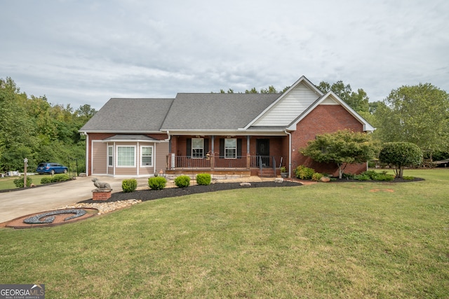 view of front facade with covered porch and a front yard