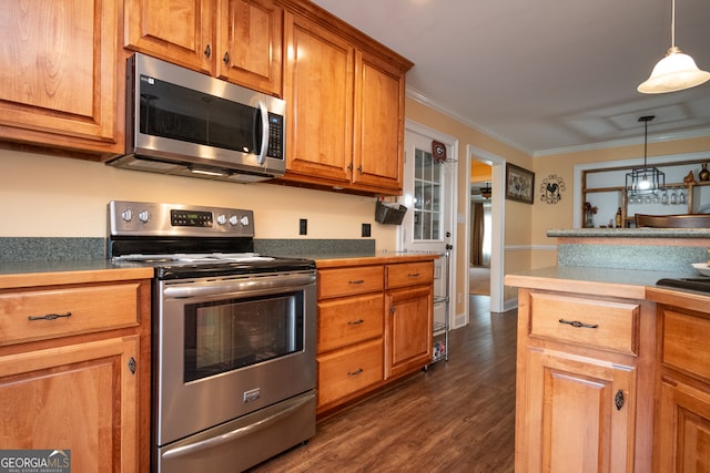 kitchen featuring ornamental molding, dark wood-type flooring, stainless steel appliances, and hanging light fixtures