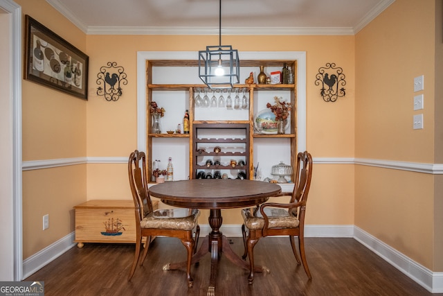 dining area featuring crown molding and dark hardwood / wood-style floors