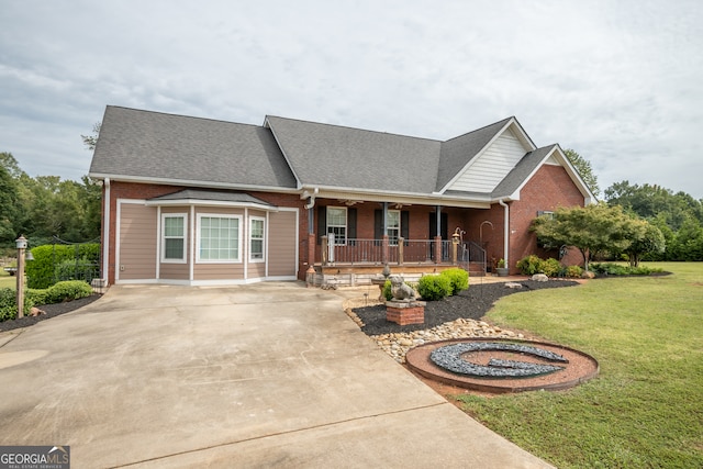 view of front of home with a porch and a front yard