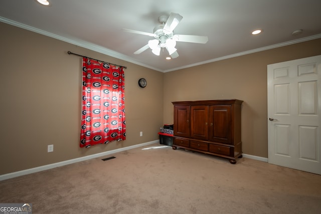 unfurnished bedroom featuring ceiling fan, light carpet, and ornamental molding