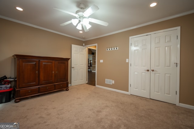 bedroom with a closet, ceiling fan, ornamental molding, and light carpet