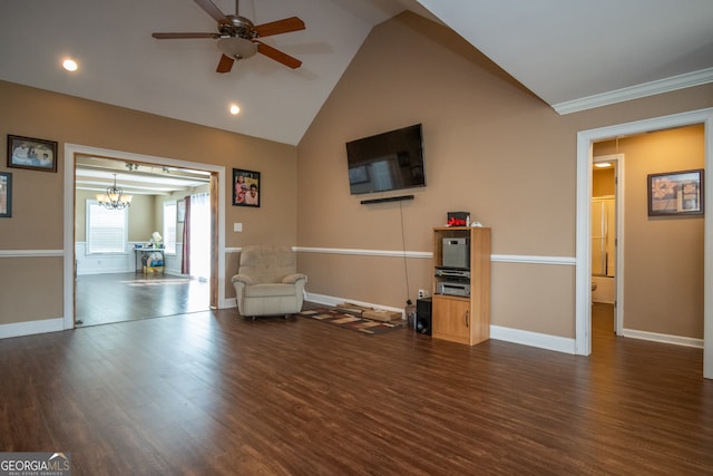 unfurnished room with dark wood-type flooring, ceiling fan with notable chandelier, high vaulted ceiling, and ornamental molding