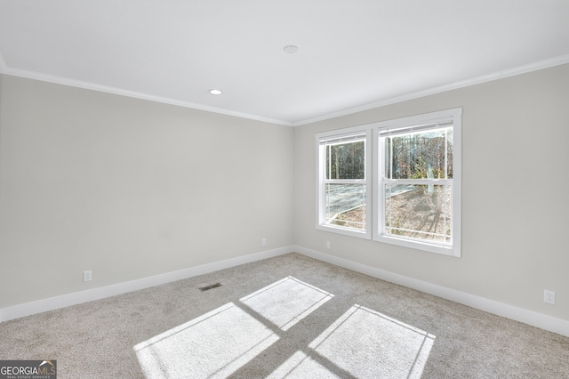 carpeted empty room with crown molding