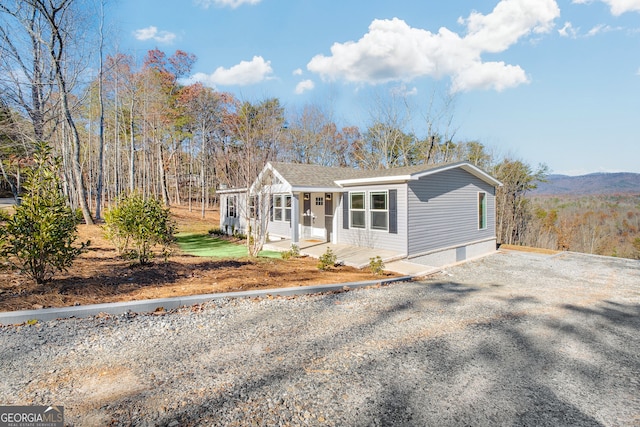 view of front of house featuring a mountain view and covered porch