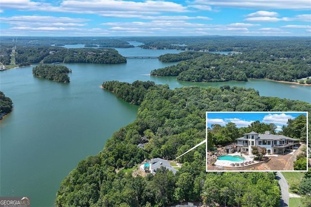 birds eye view of property with a water view